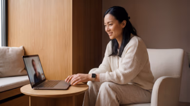 Employee attending a virtual wellness coaching session on a laptop